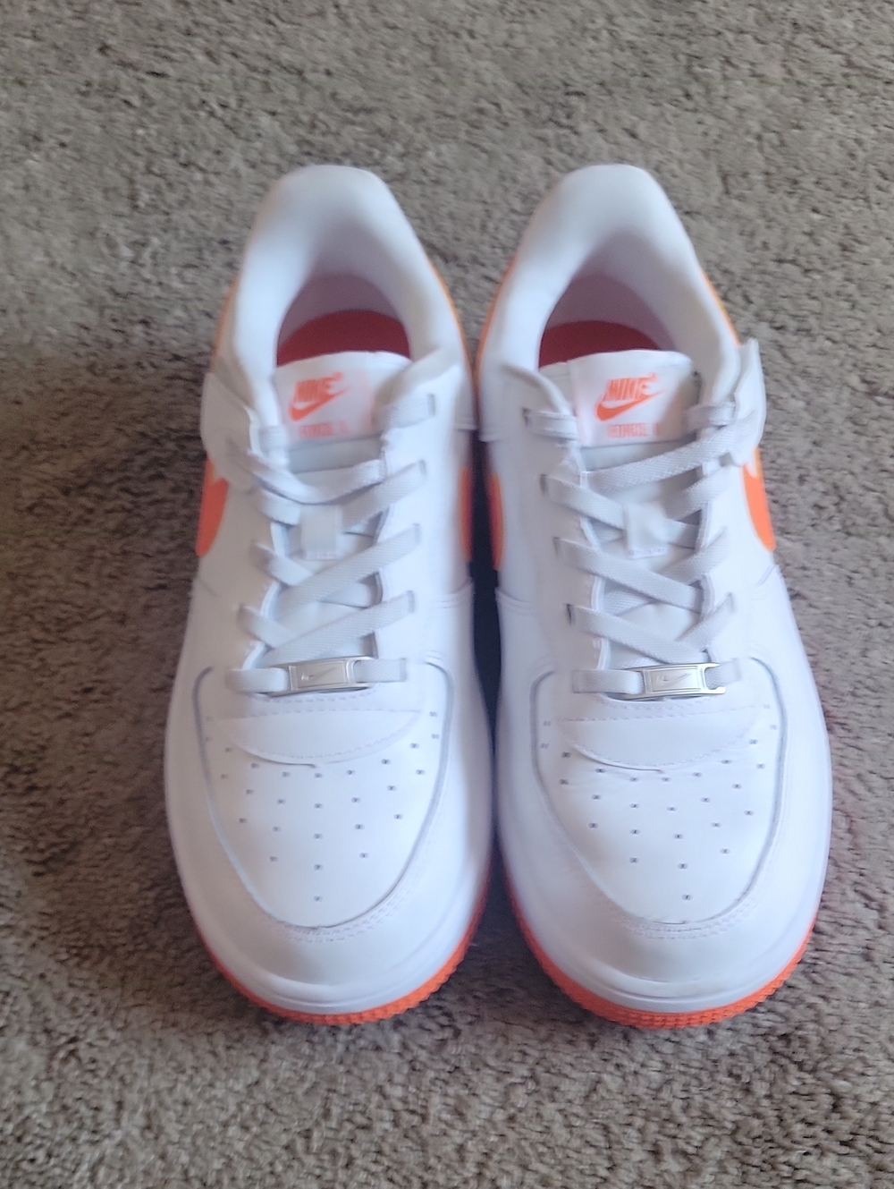 Nike Kids White Sneakers with Orange Swoosh